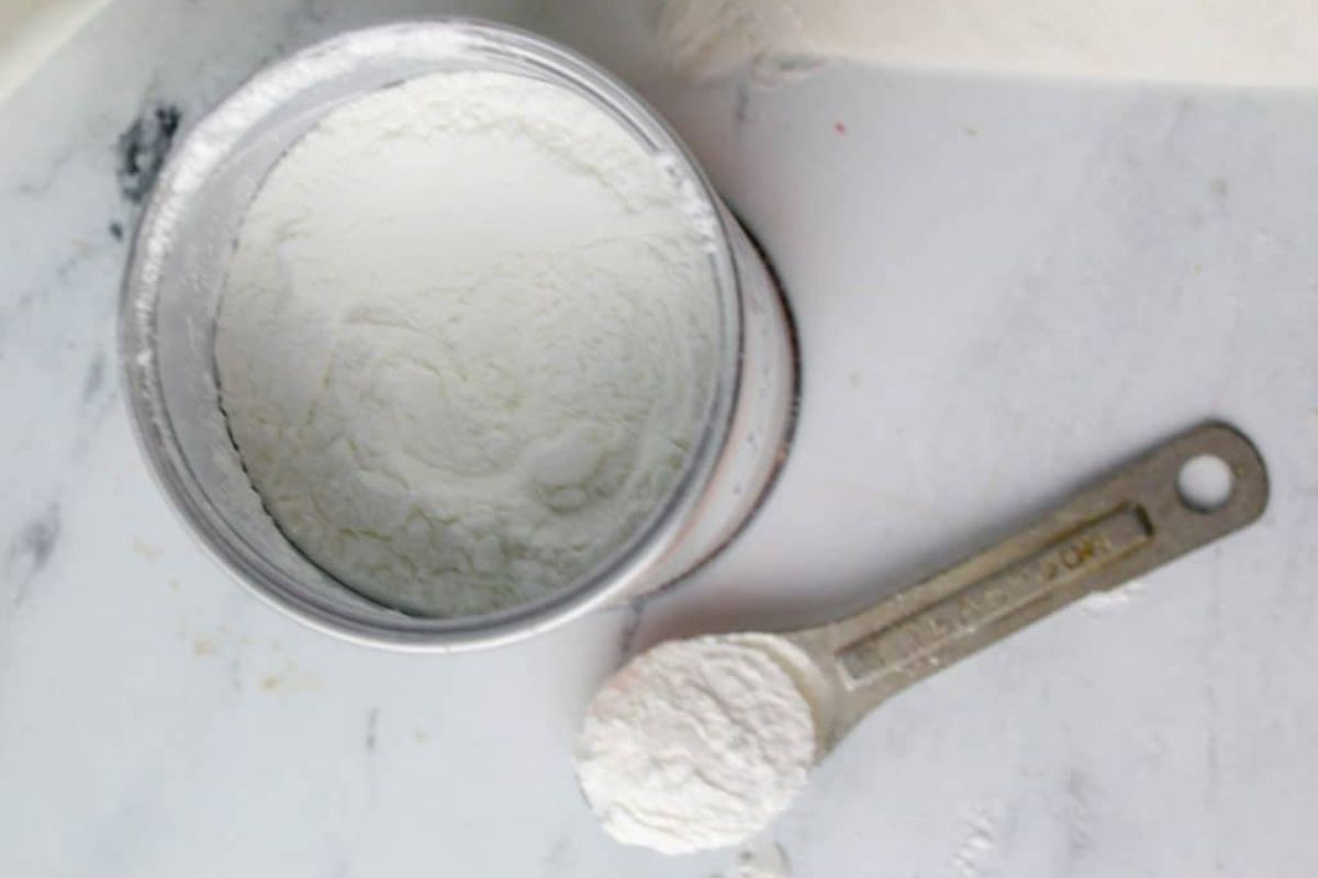 baking powder can and a measuring spoon