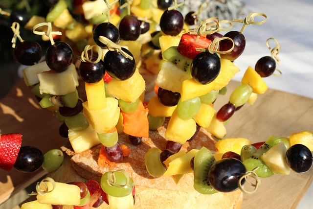 Delicious fruit skewers as a fun alternative appetizer idea to serve at your baby shower. 