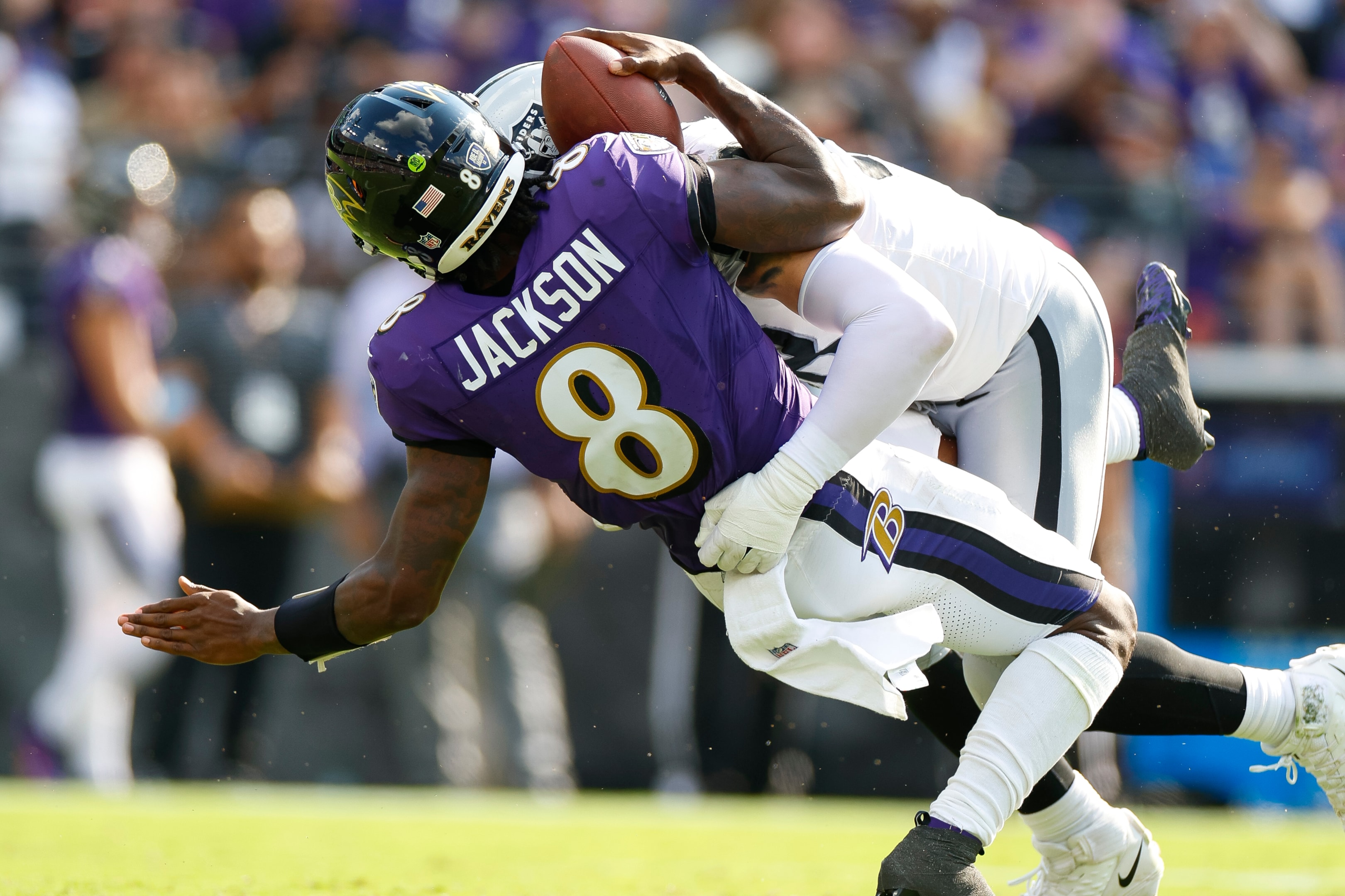 Maxx Crosby of the Las Vegas Raiders sacks Lamar Jackson of the Baltimore Ravens during an NFL football game on September 15, 2024 in Baltimore, Maryland.