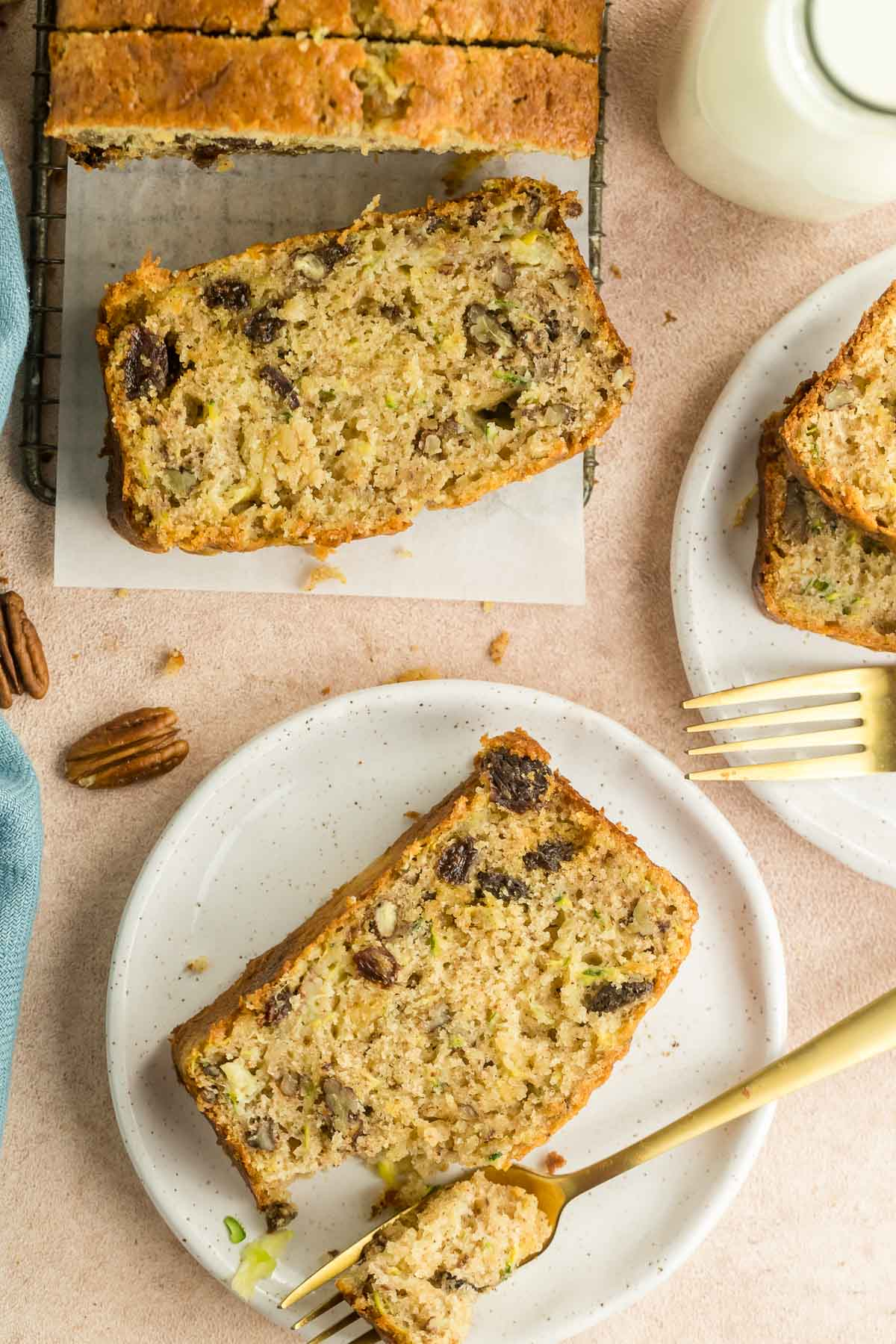 slice of pineapple zucchini loaf on a plate with a fork