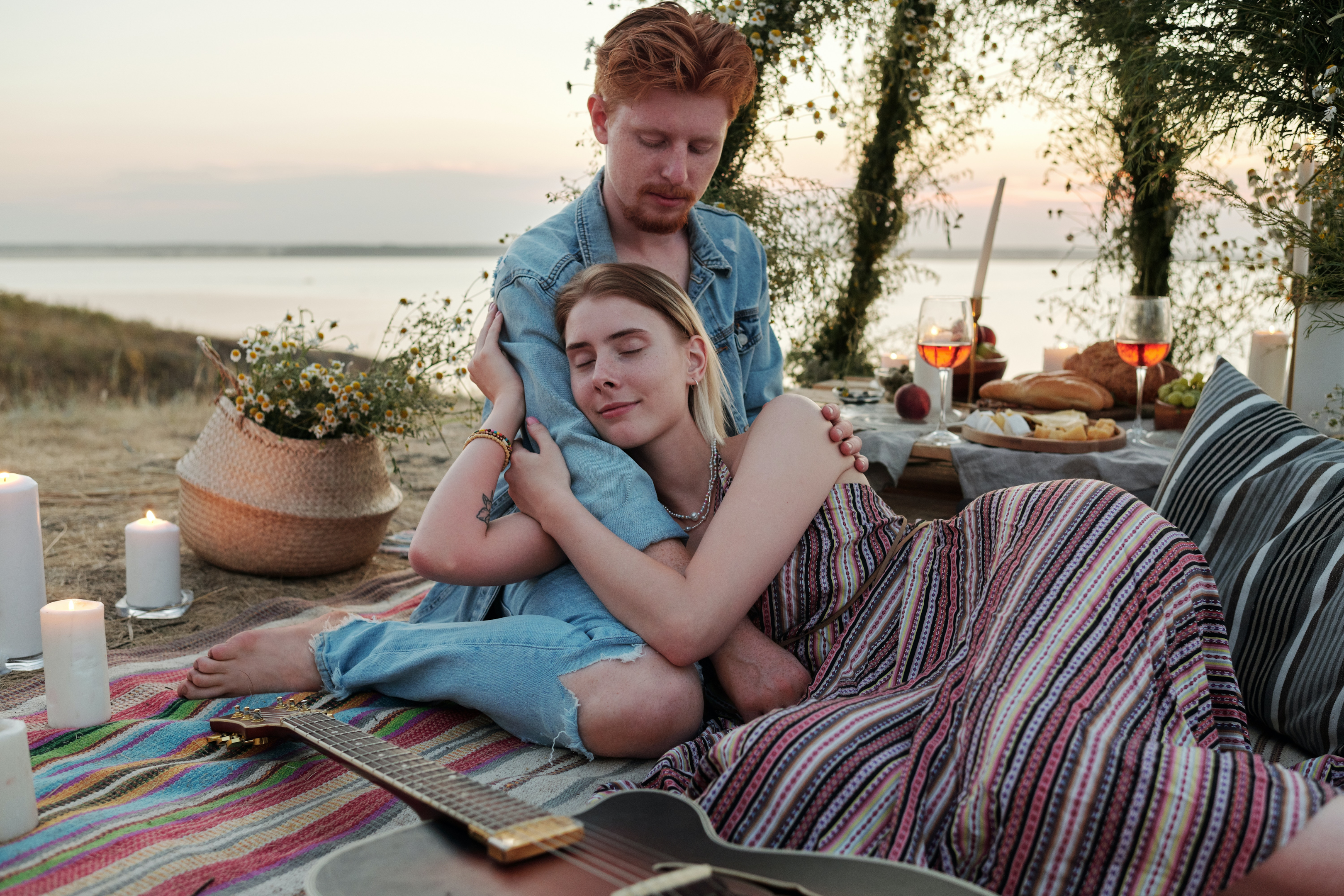 couple sitting on blanket 