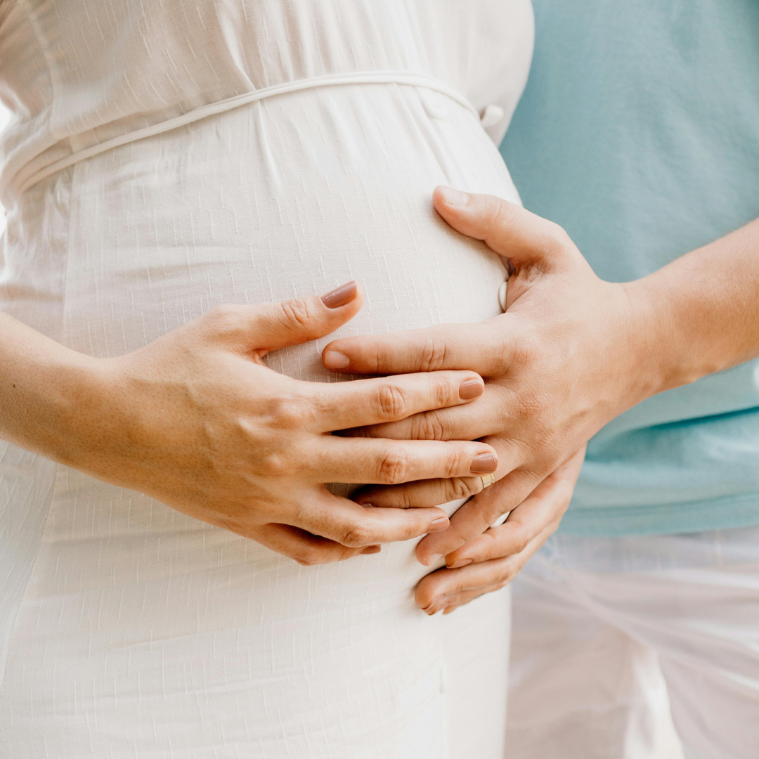 parents-to-be close up of hands in maternity photoshoot