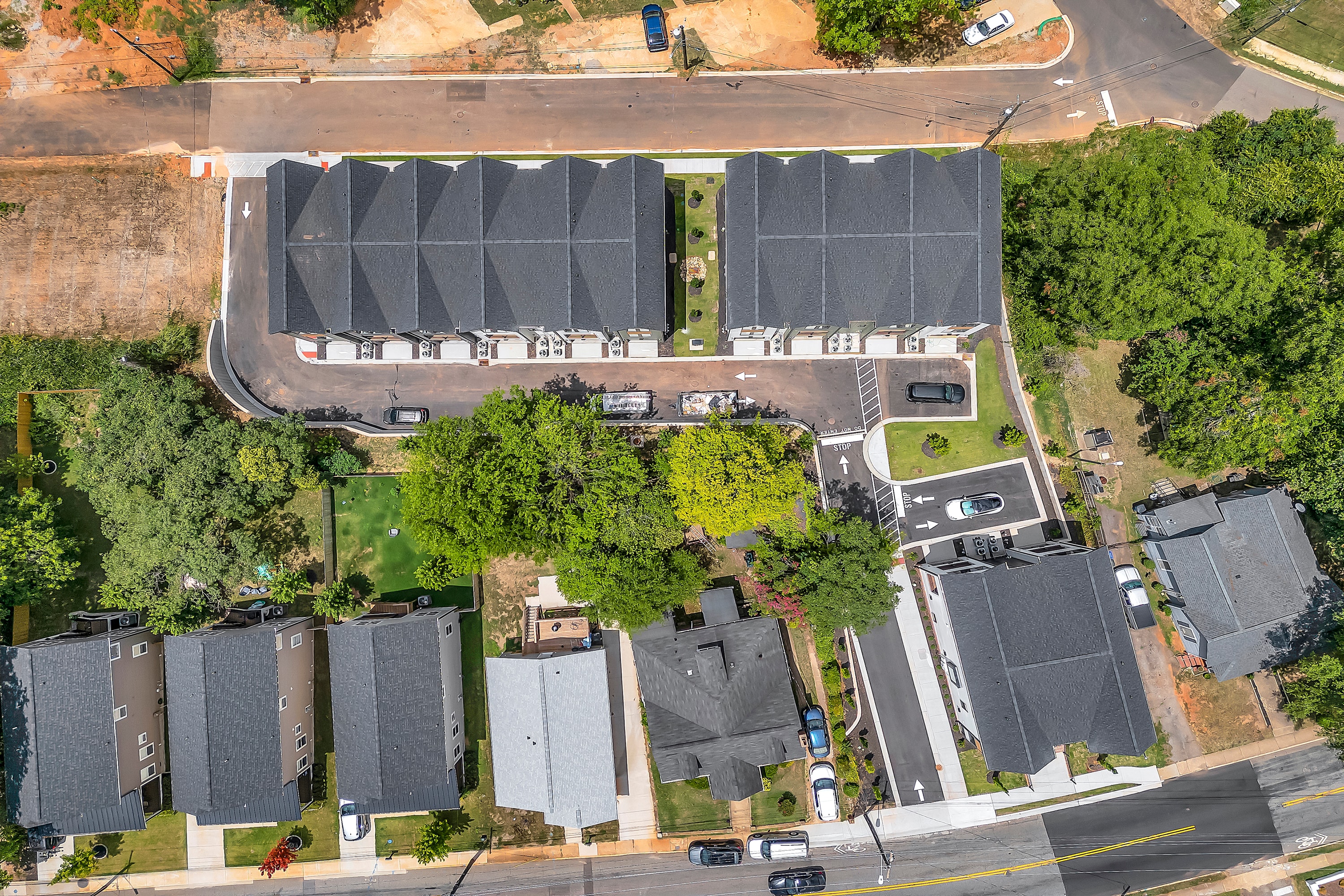 A modern multifamily buildings feature energy efficent appliances, showcasing sustainable practices in urban multifamily construction projects. The design emphasizes energy efficiency and provides communal outdoor spaces for residents.