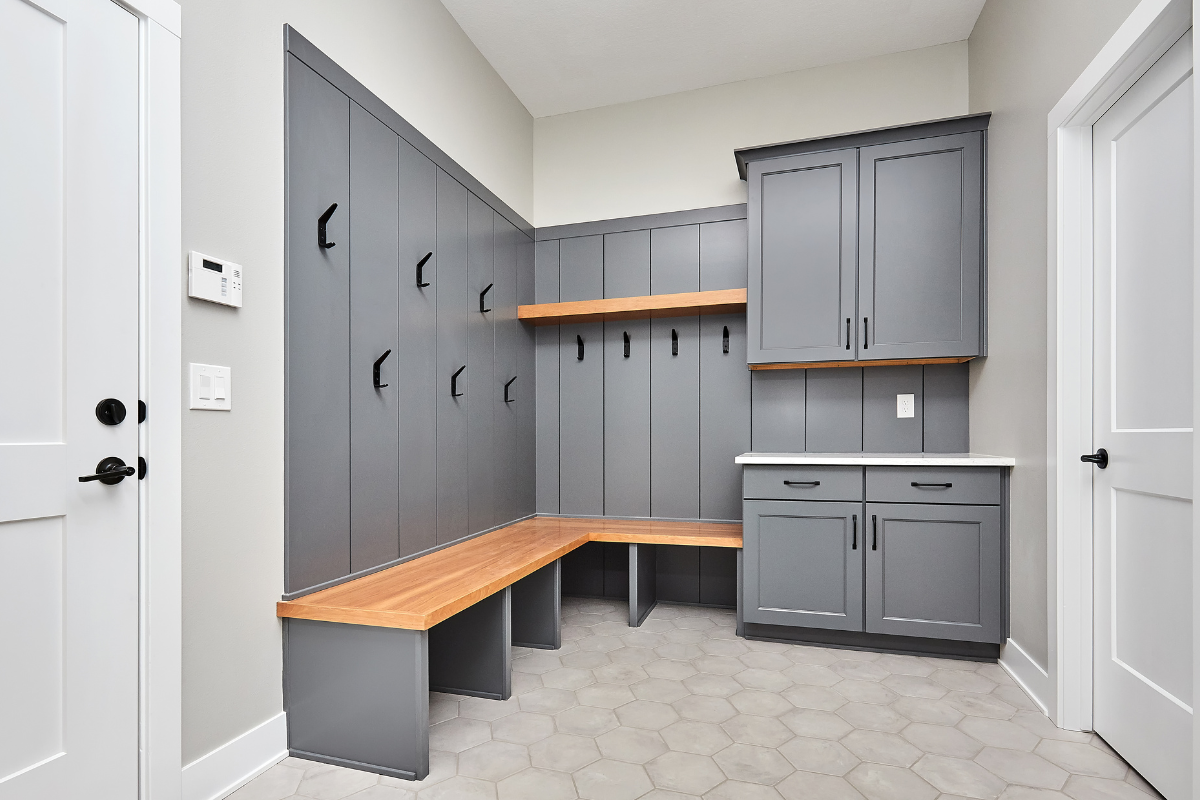 Stylish shelves incorporated into an entryway for storage and decor.