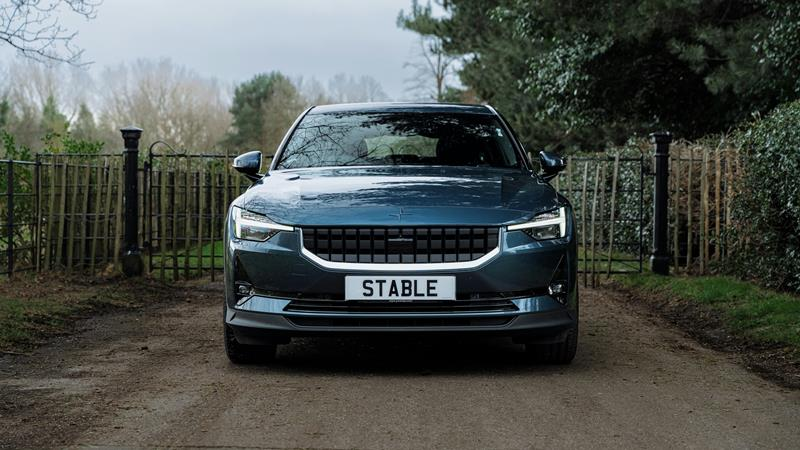 Front view of Polestar 2 car with headlights on