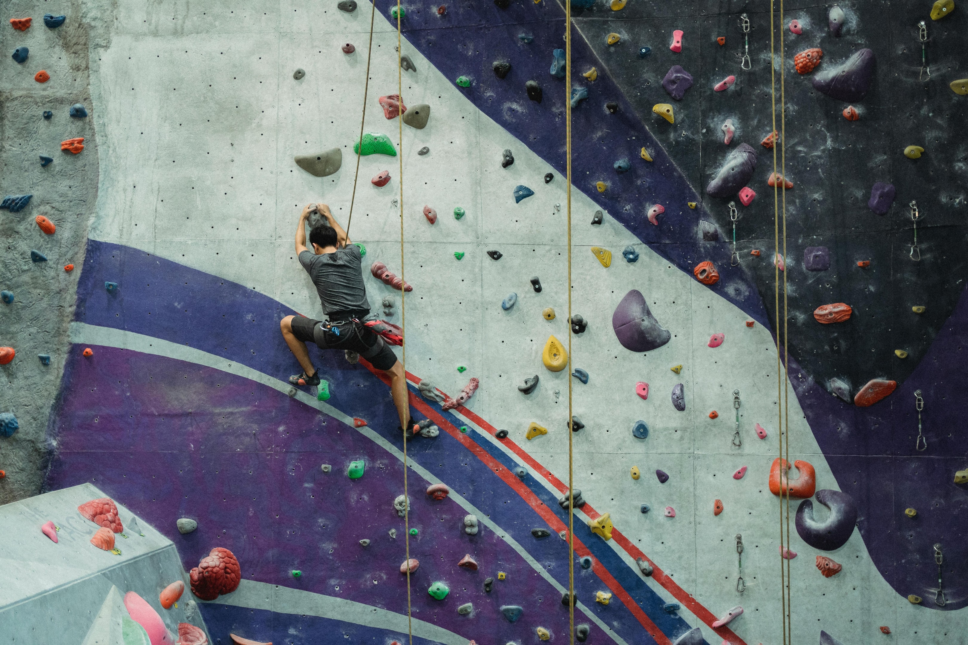 Photo by Allan Mas: https://www.pexels.com/photo/faceless-man-practicing-on-climbing-wall-5383780/