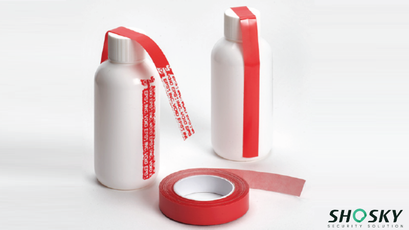 FDA-approved red security label with warning text applied to white medicine bottles