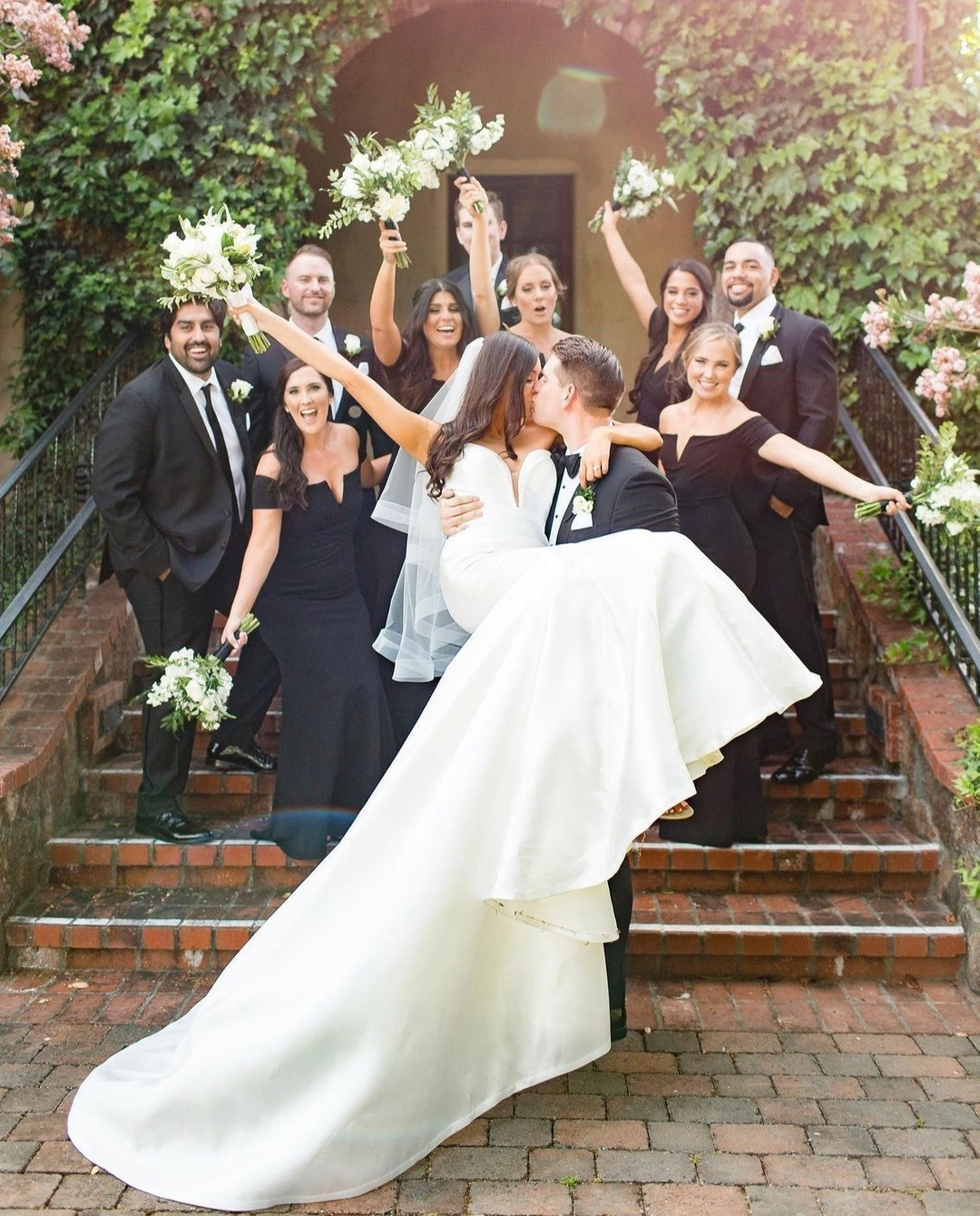 A bride wearing a universally flattering A-line silhouette with a plunging neckline and timeless skirt