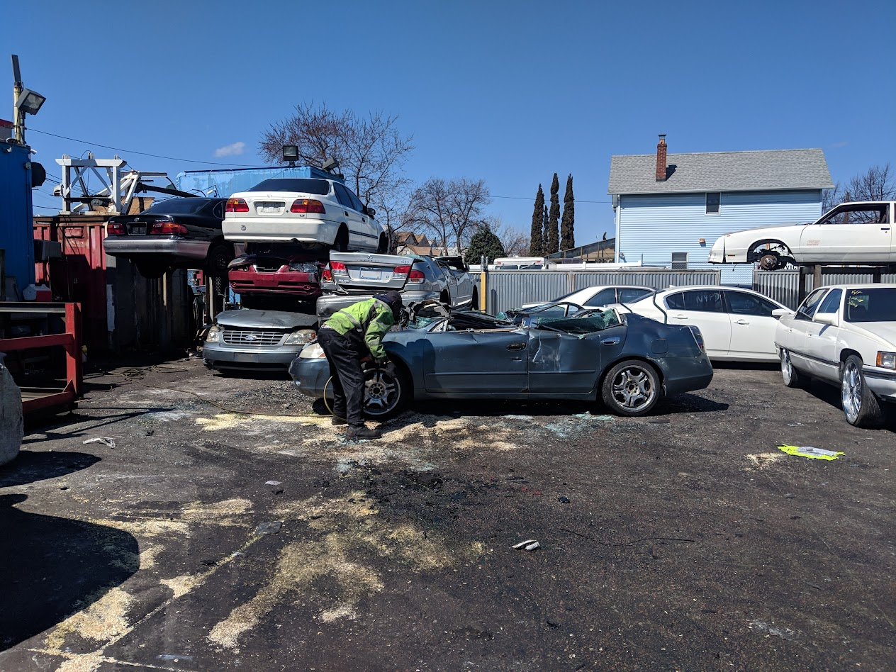 A person verifying licenses and reviews of a junk car buyer