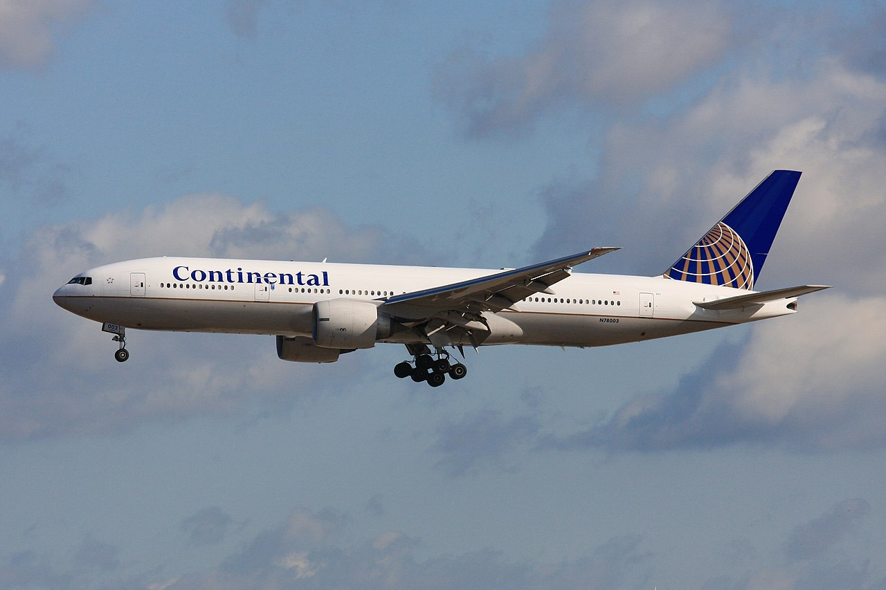 Continental airlines aircraft flying.