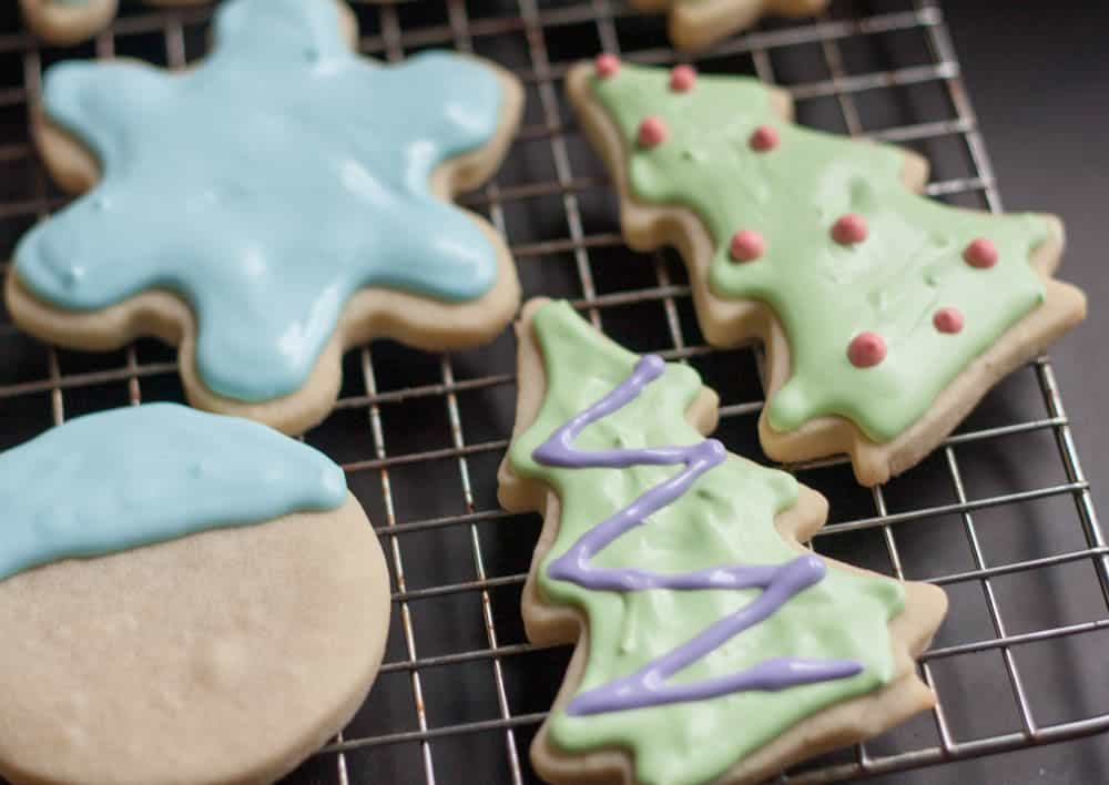 Christmas cookies with royal icing on a wire rack