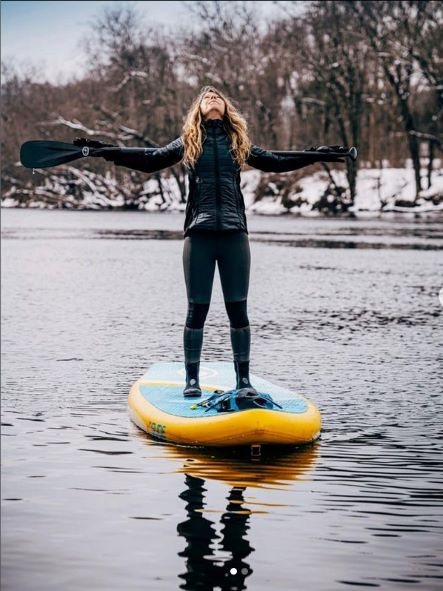 standing on a paddle board