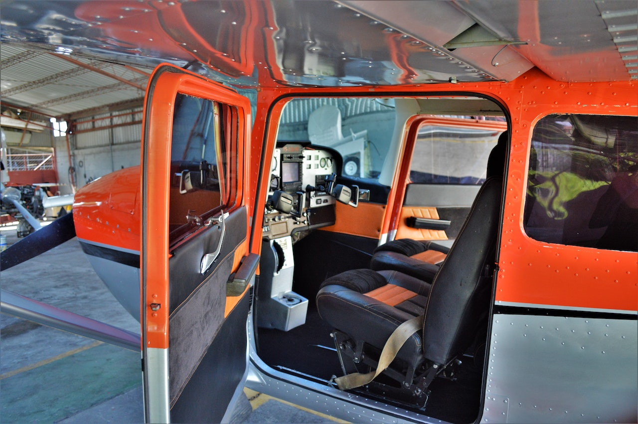 A small aircraft stationed for repairs in 