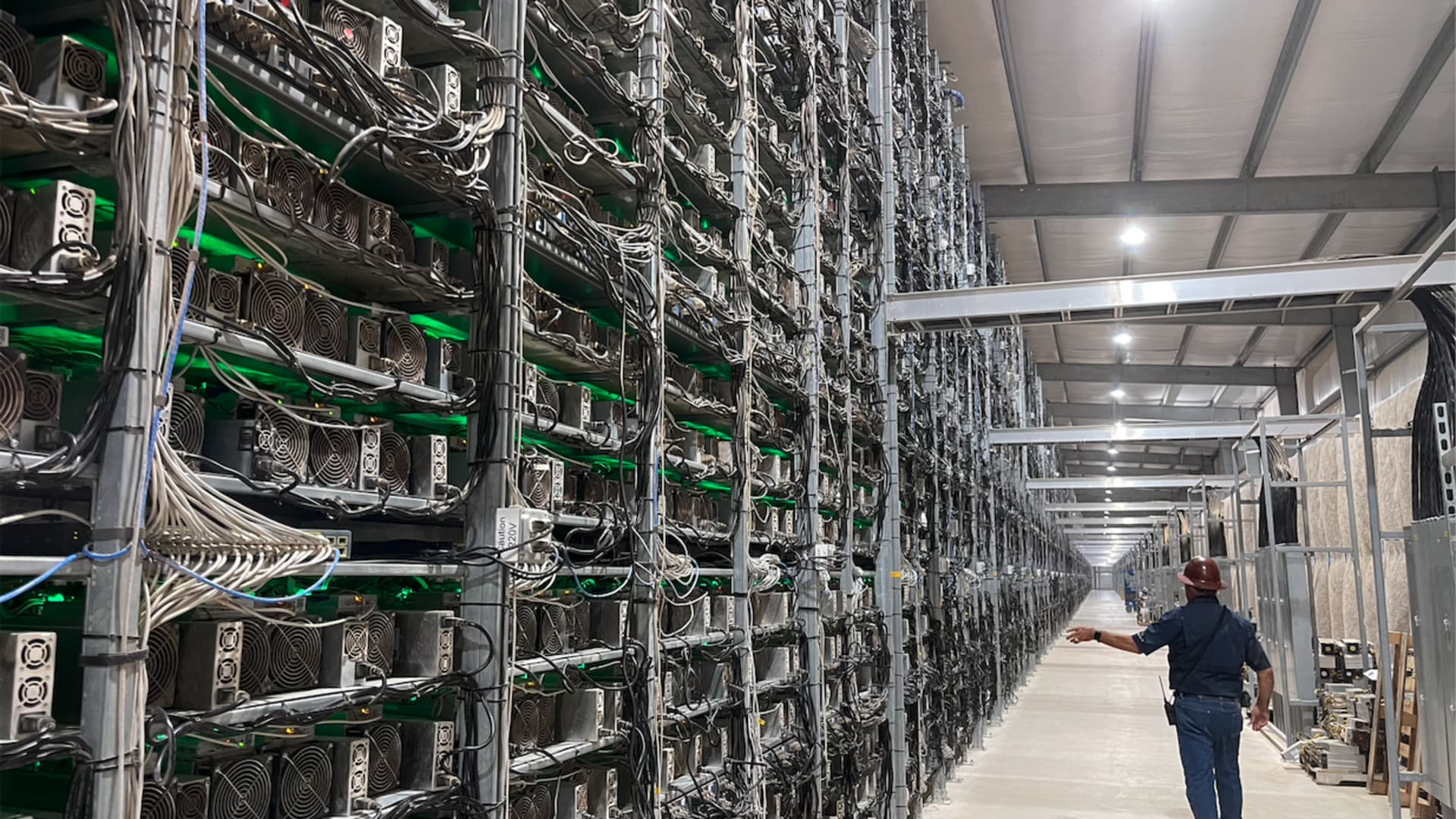 A visual representation of bitcoin mining operations, showcasing miners and their equipment in action.