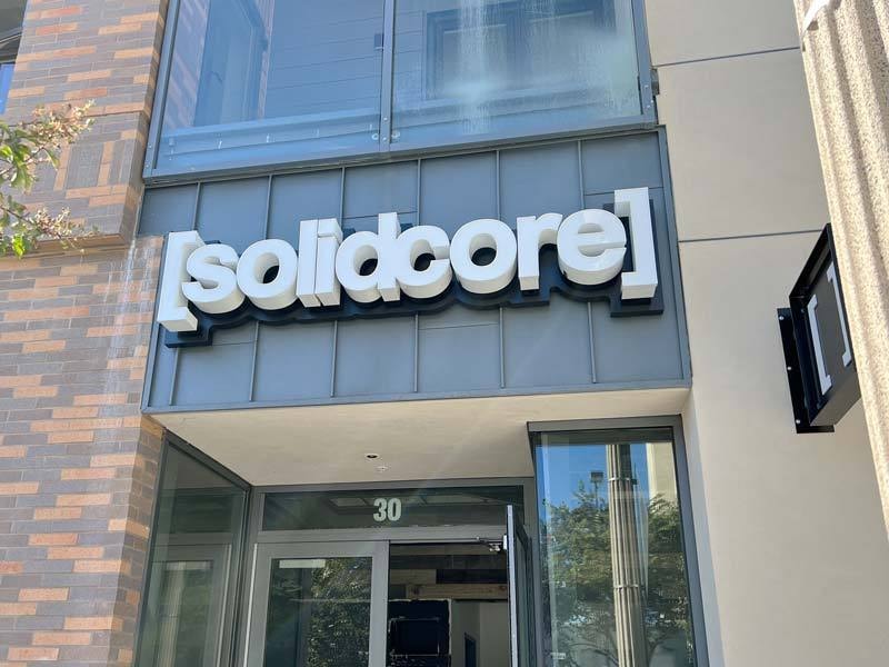 Ship-in channel letter sign installation for Solidcore’s storefront in Pasadena, California.