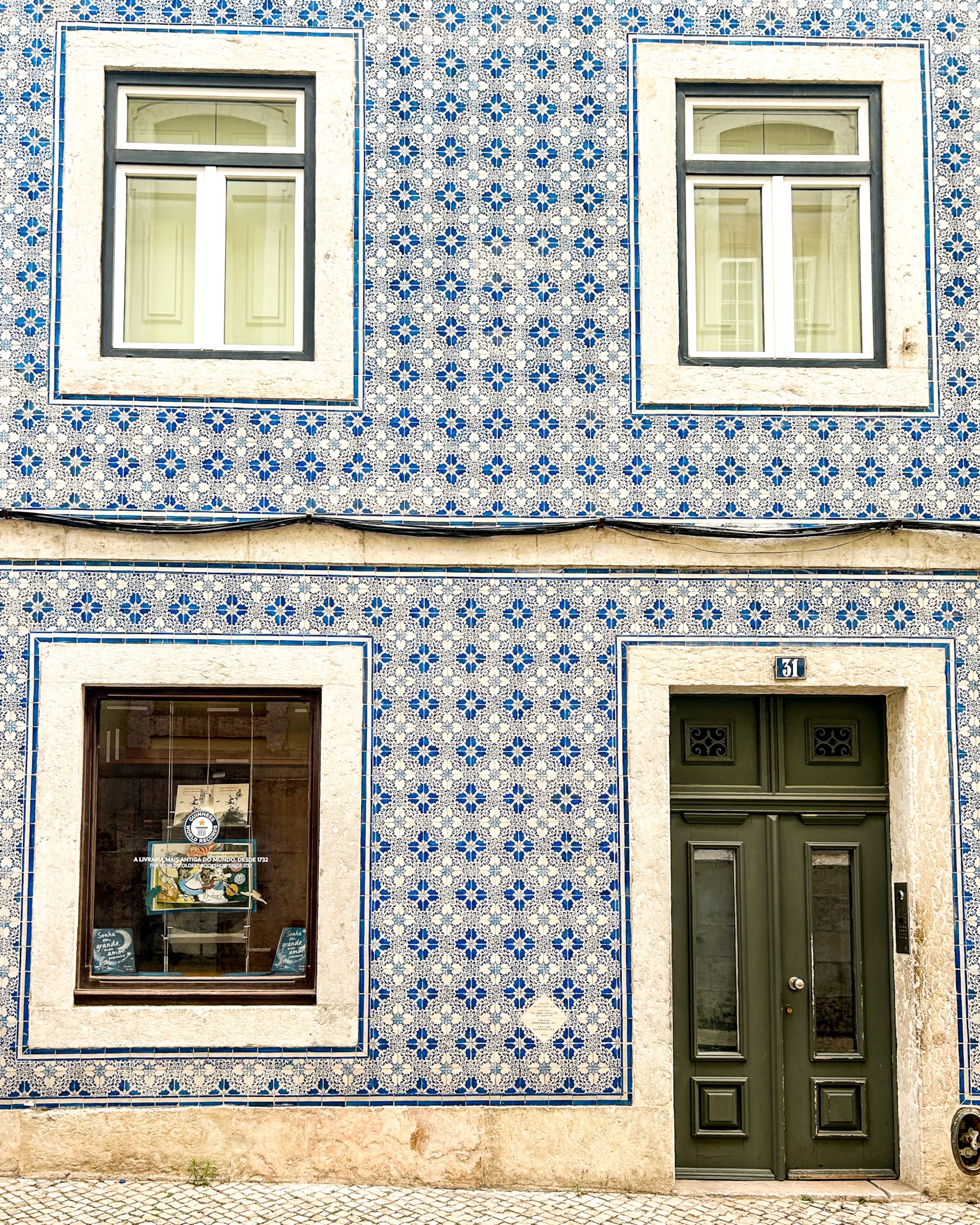 Where to stay in Lisbon blue and white tile building in Lisbon, Portugal