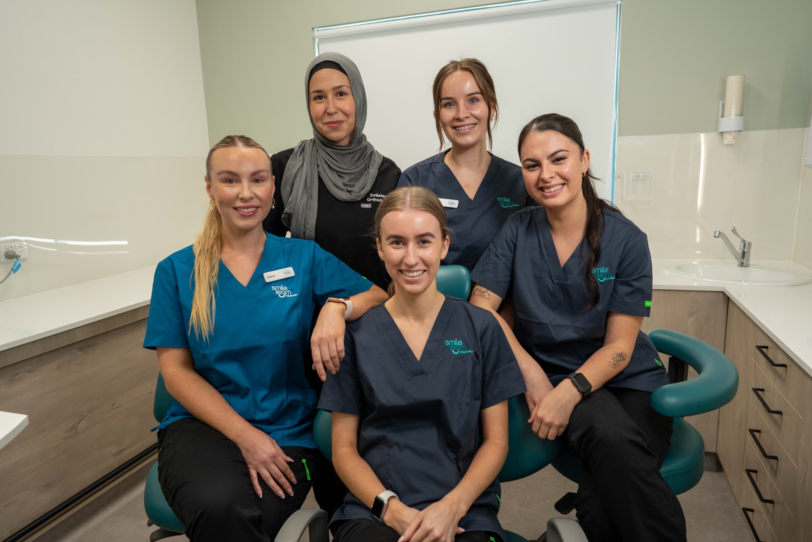 Happy Smile Team staff members in clinic