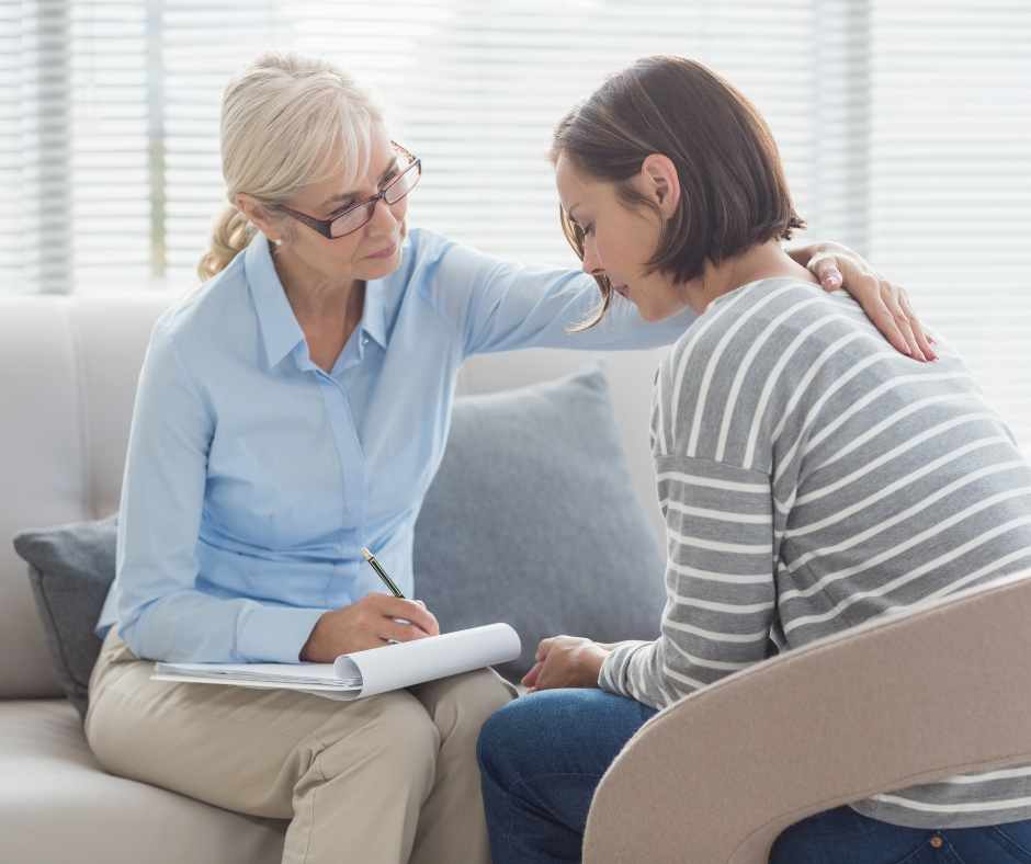                                              A person talking to a therapist about their drinking problem