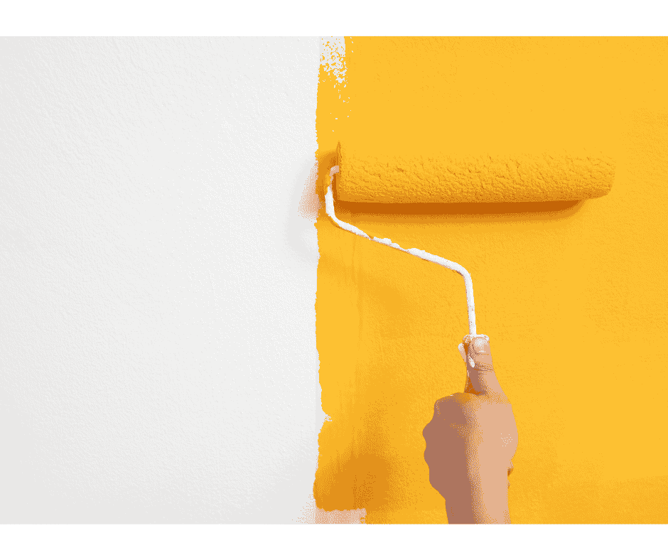 quality yellow paint being painting on wall with roller brush