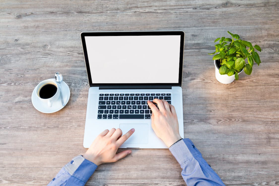 A test engineer is working with testing tools on a laptop