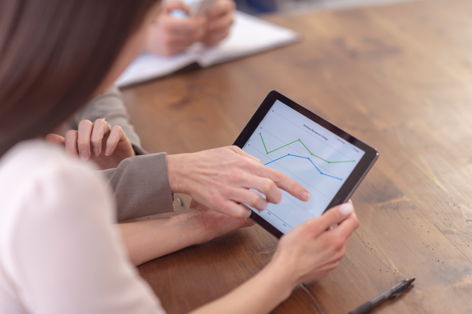 Professionals looking at tab.