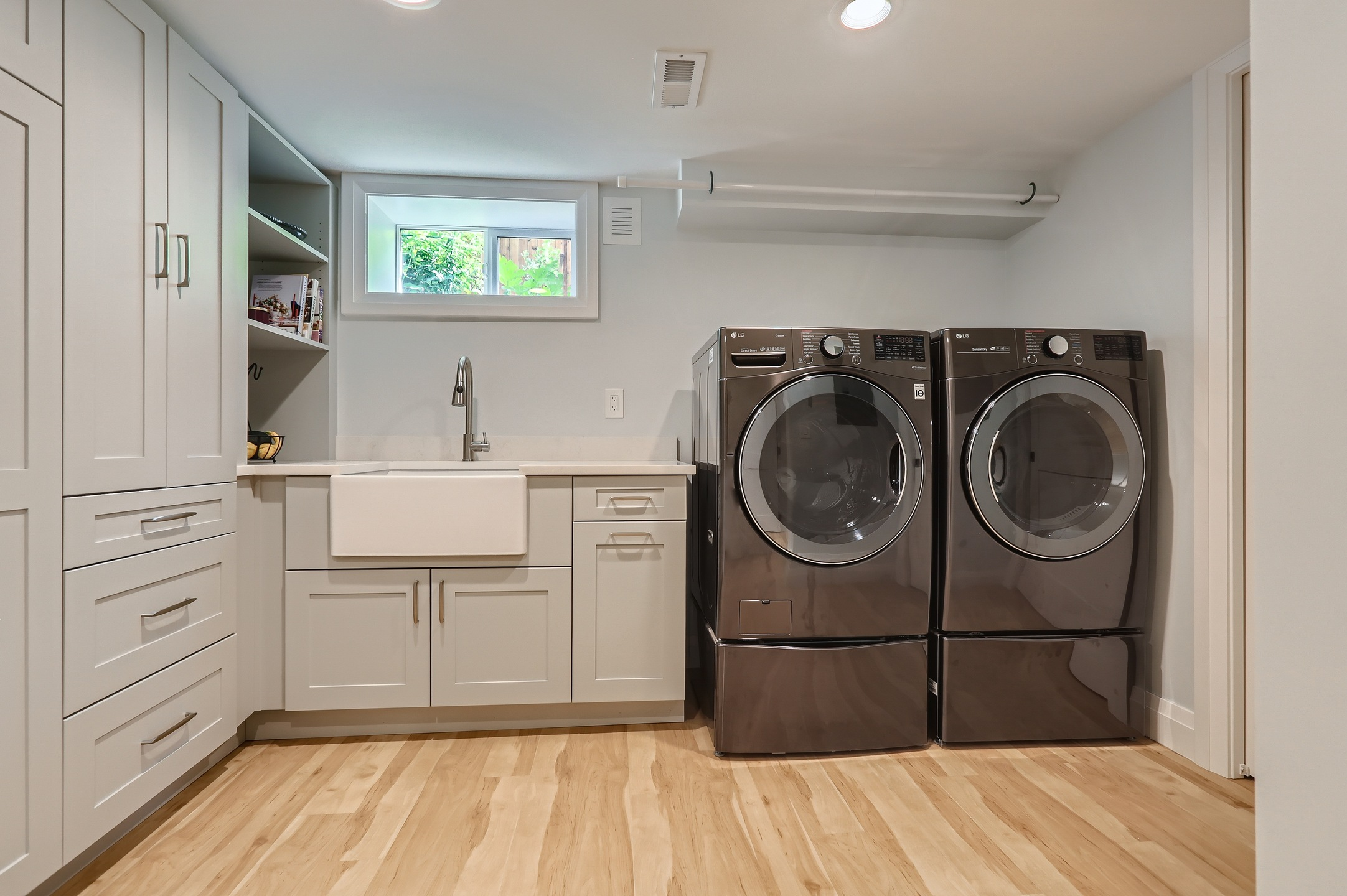 A stationary washer and dryer combo with a bigger washing and drying capacity in a basement apartment 