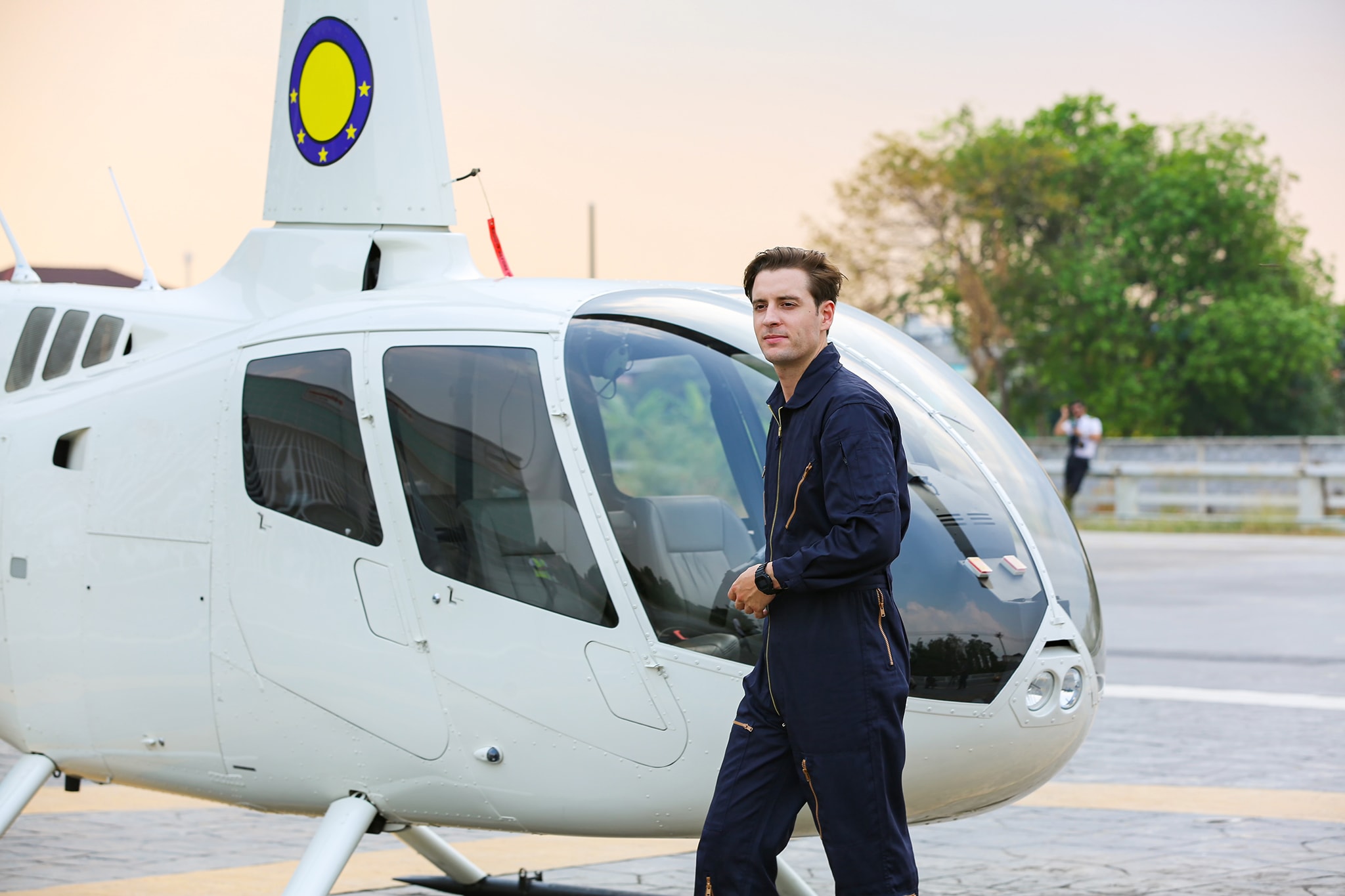 pilot with a Robinson helicopter in airplane