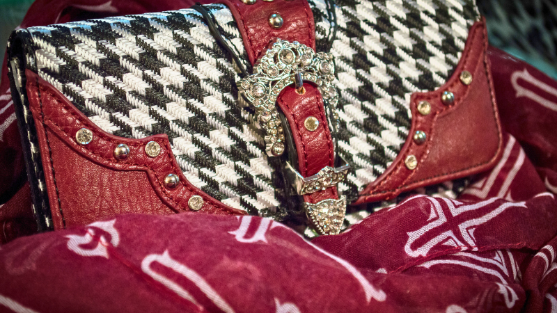 A red and white purse with a houndstooth pattern