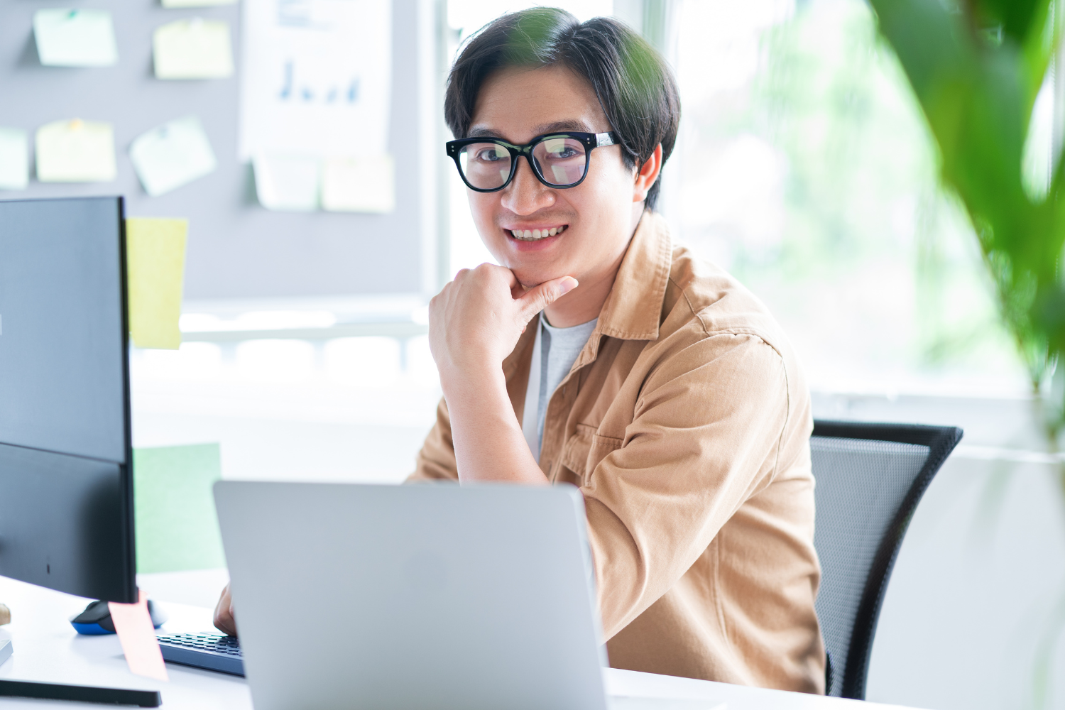 A Filipino remote worker smiling.