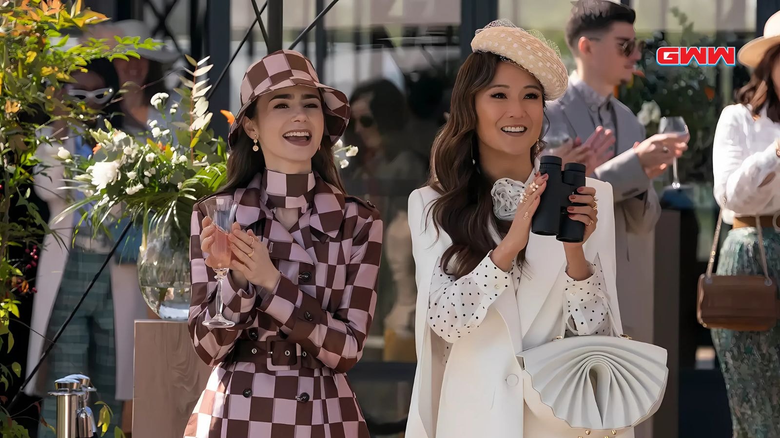 Lily Collins as Emily and Ashley Park as Mindy in Emily in Paris