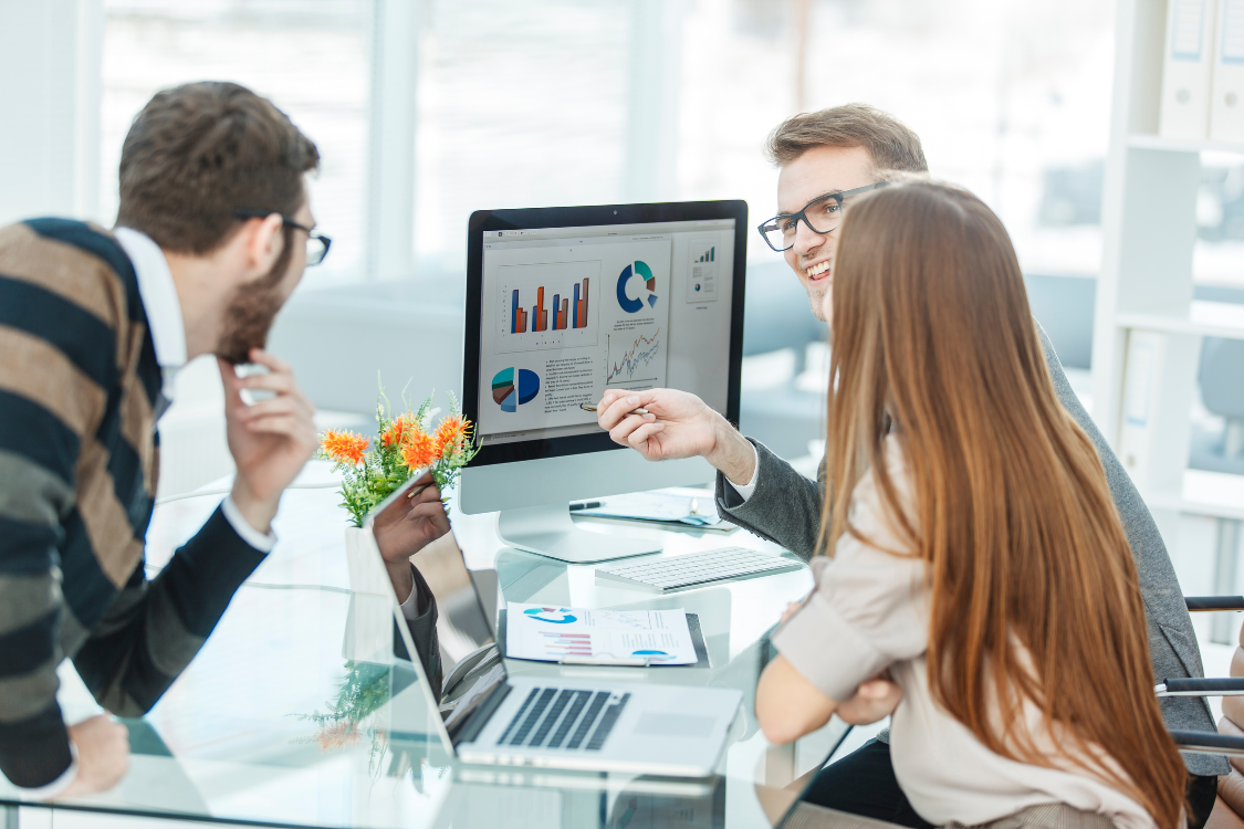Digital marketing specialist reviewing campaign performance charts during a remote team meeting