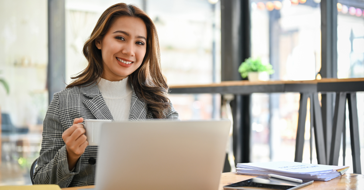 Woman reviewing a solo 401k calculator for OnlyFans tax planning.