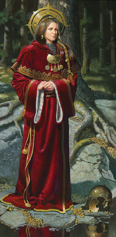 Danu is in a red cloack adorned with gold as well as a gold crown over her brown braided hair. She stands in front of a tree with giant roots.