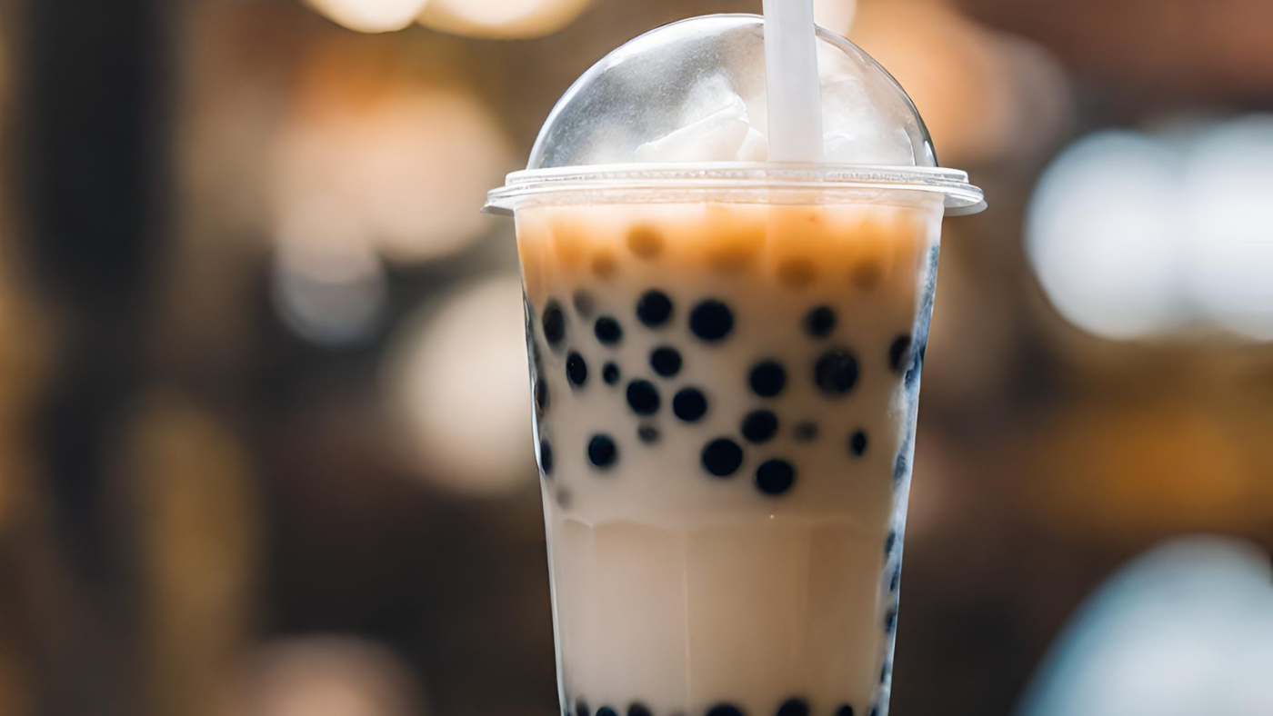 A cup of bubble tea with cooked tapioca pearls