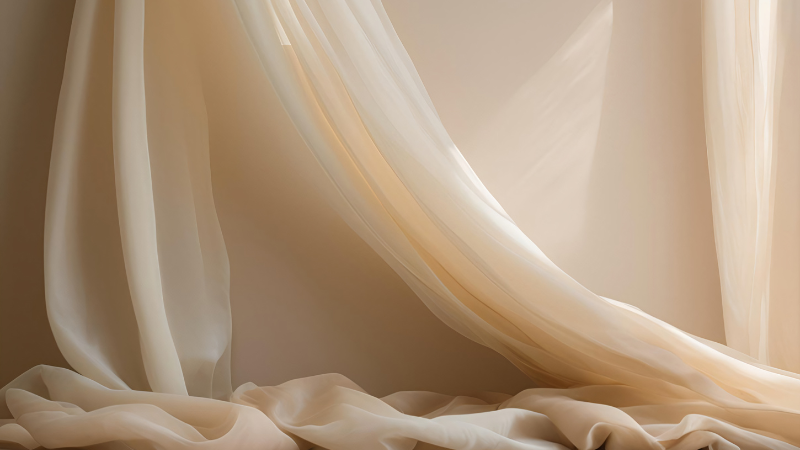 Organza curtains on a wall in front of a window