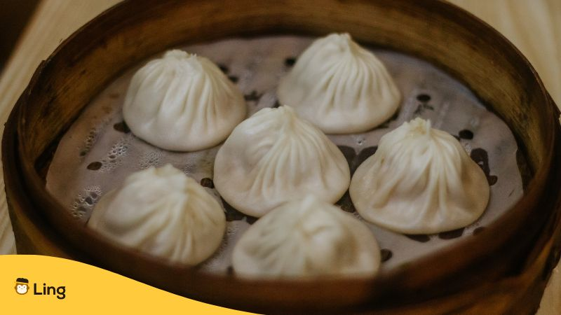 A Close-up Shot of Steamed Dumplings on a Bamboo Steamer