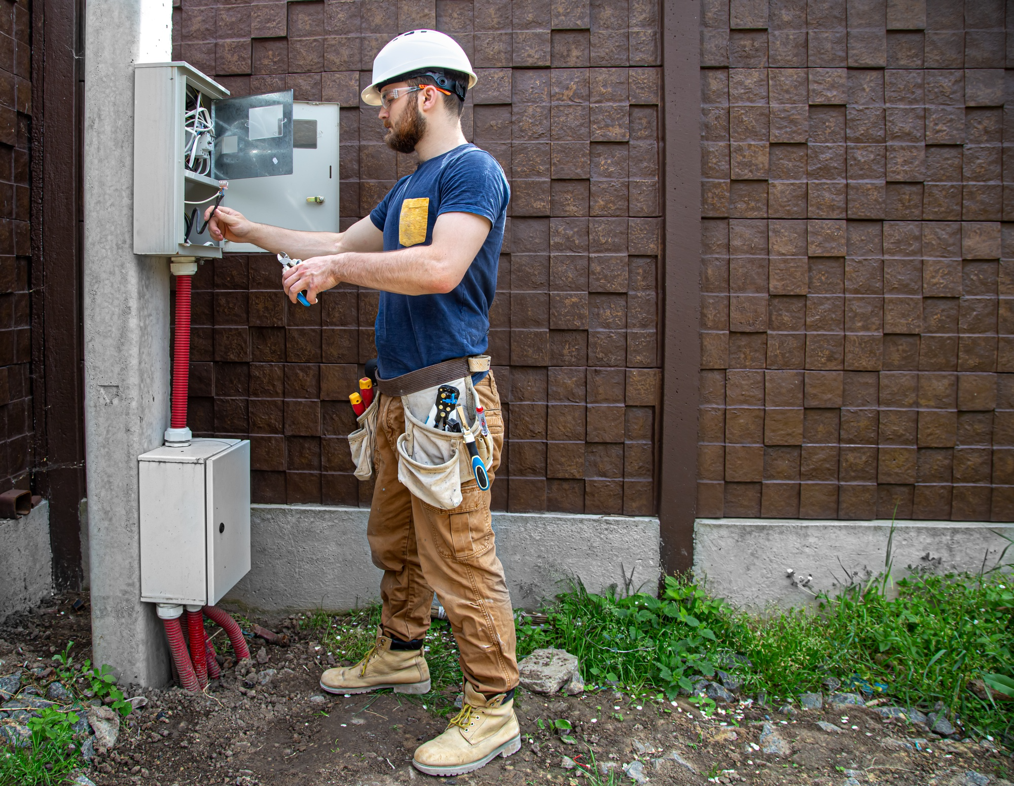 A man fixing an electrical problem