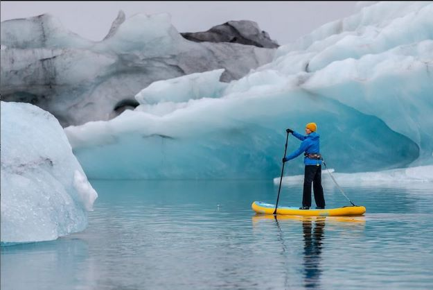 paddle board near glaciers