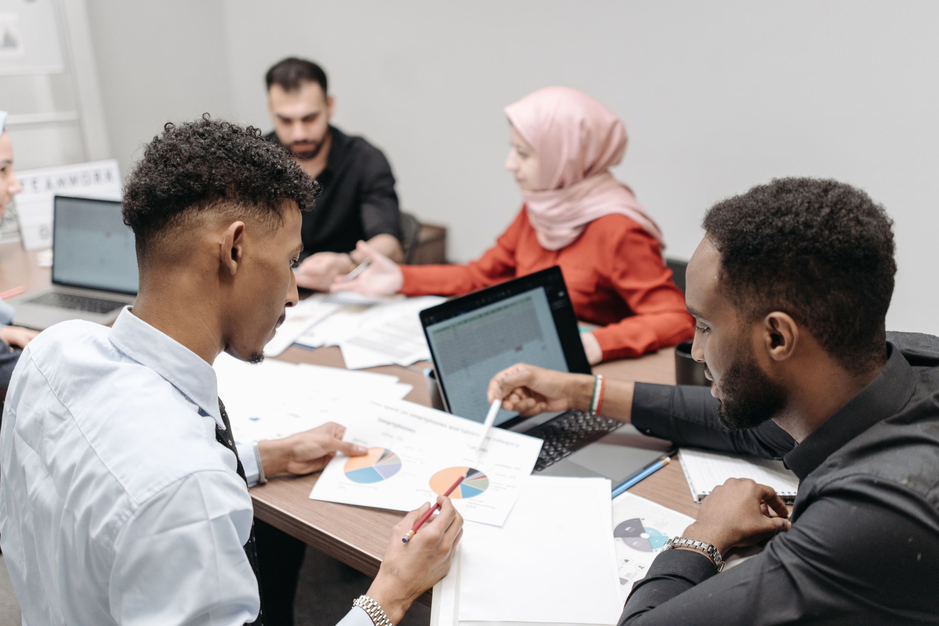 People analyzing a business report