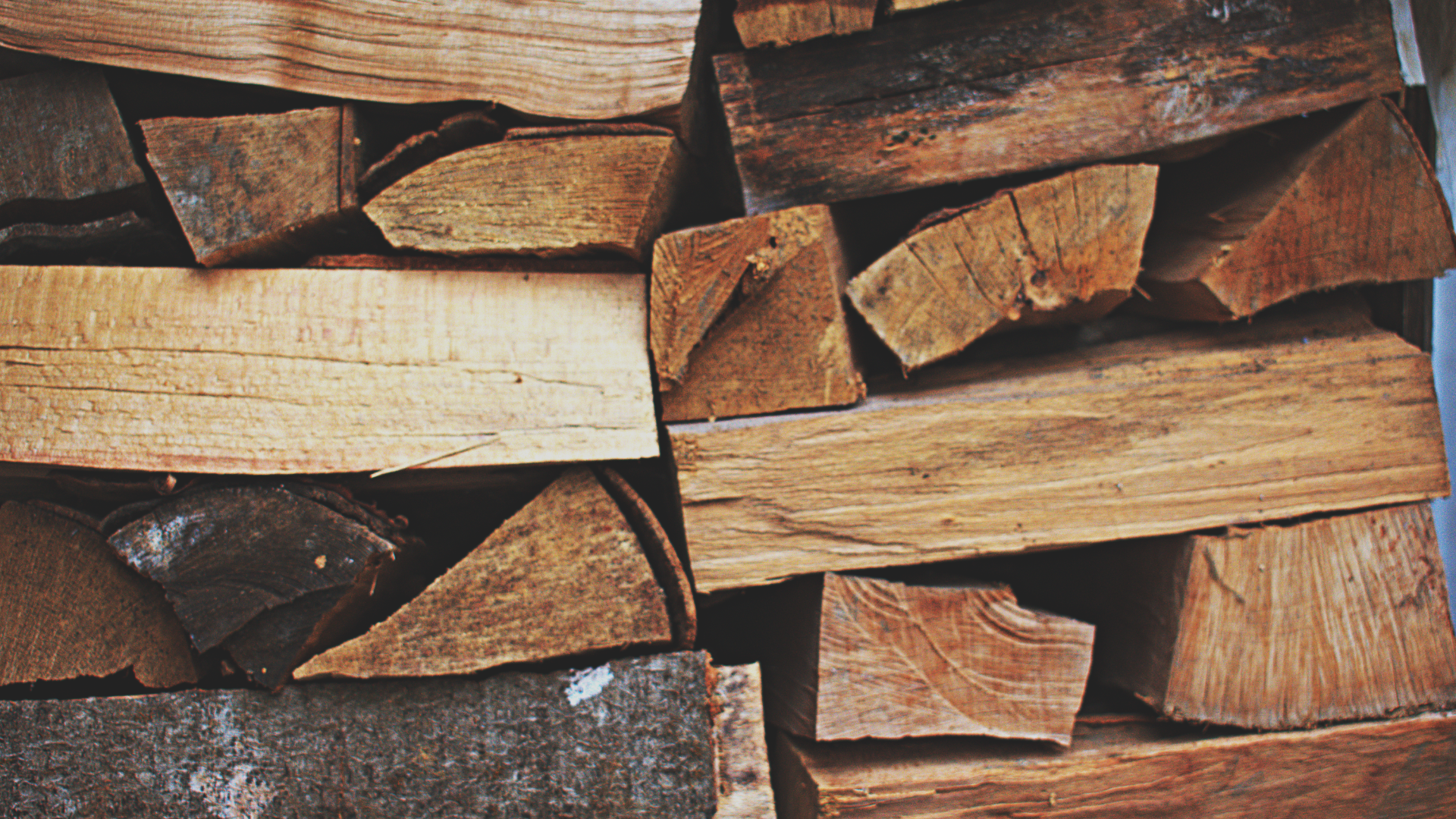 A criss cross stack of firewood.