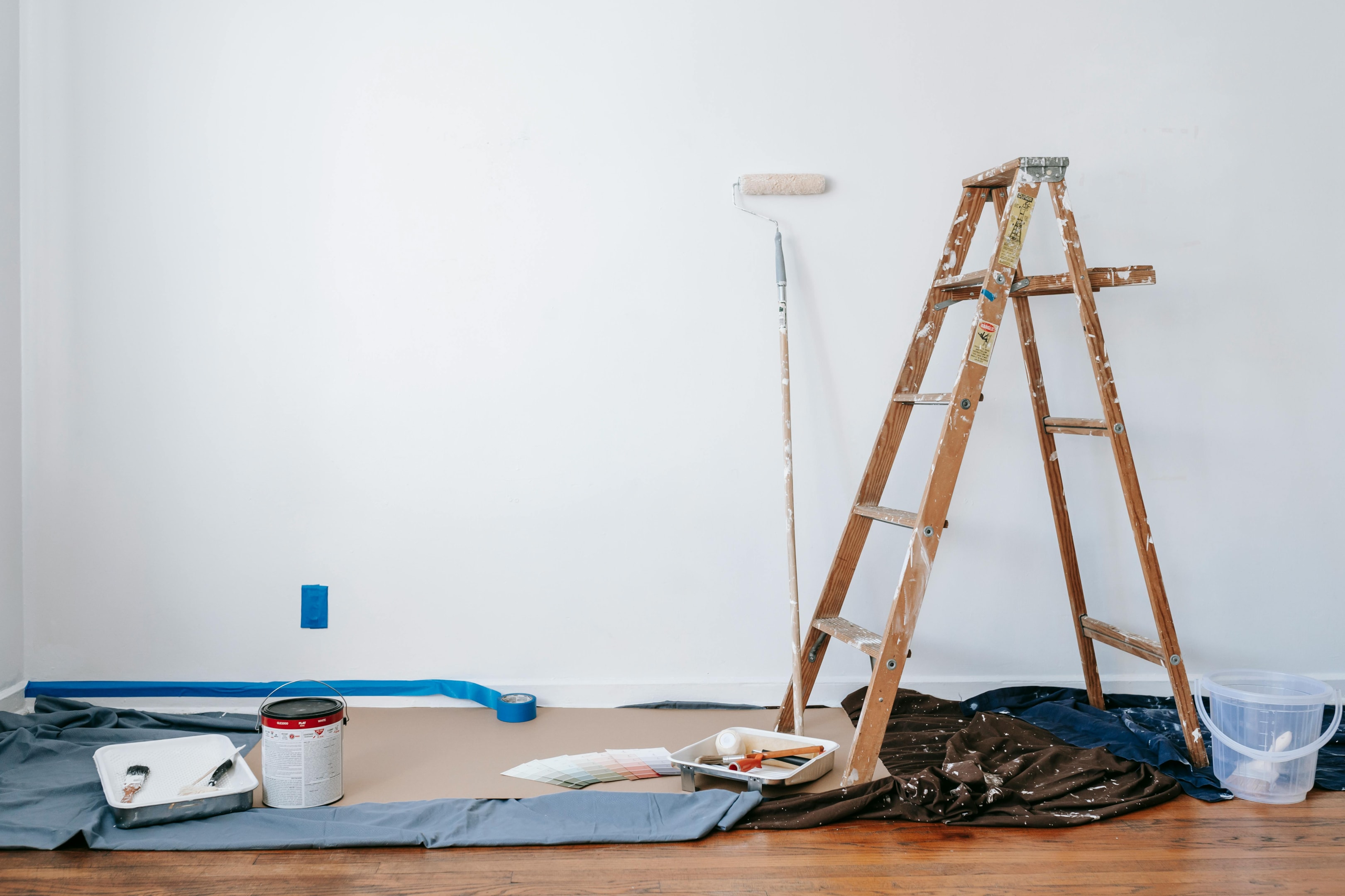 Paint supplies set up in a house being renovated and flipped. 