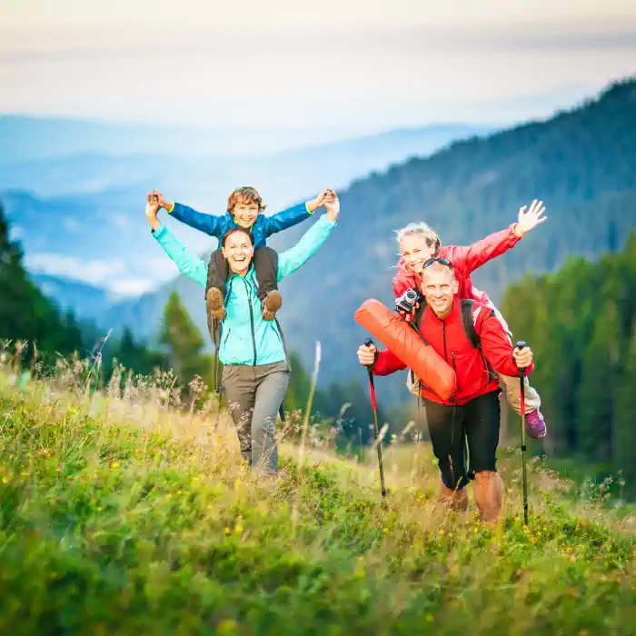Energetic family hiking in the mountains, showcasing the CHINAHERB Supplement Collection, formulated with Chinese herbs and endorsed by TCM practitioners, rooted in oriental medicine, available at The Good Stuff Health Shop South Africa