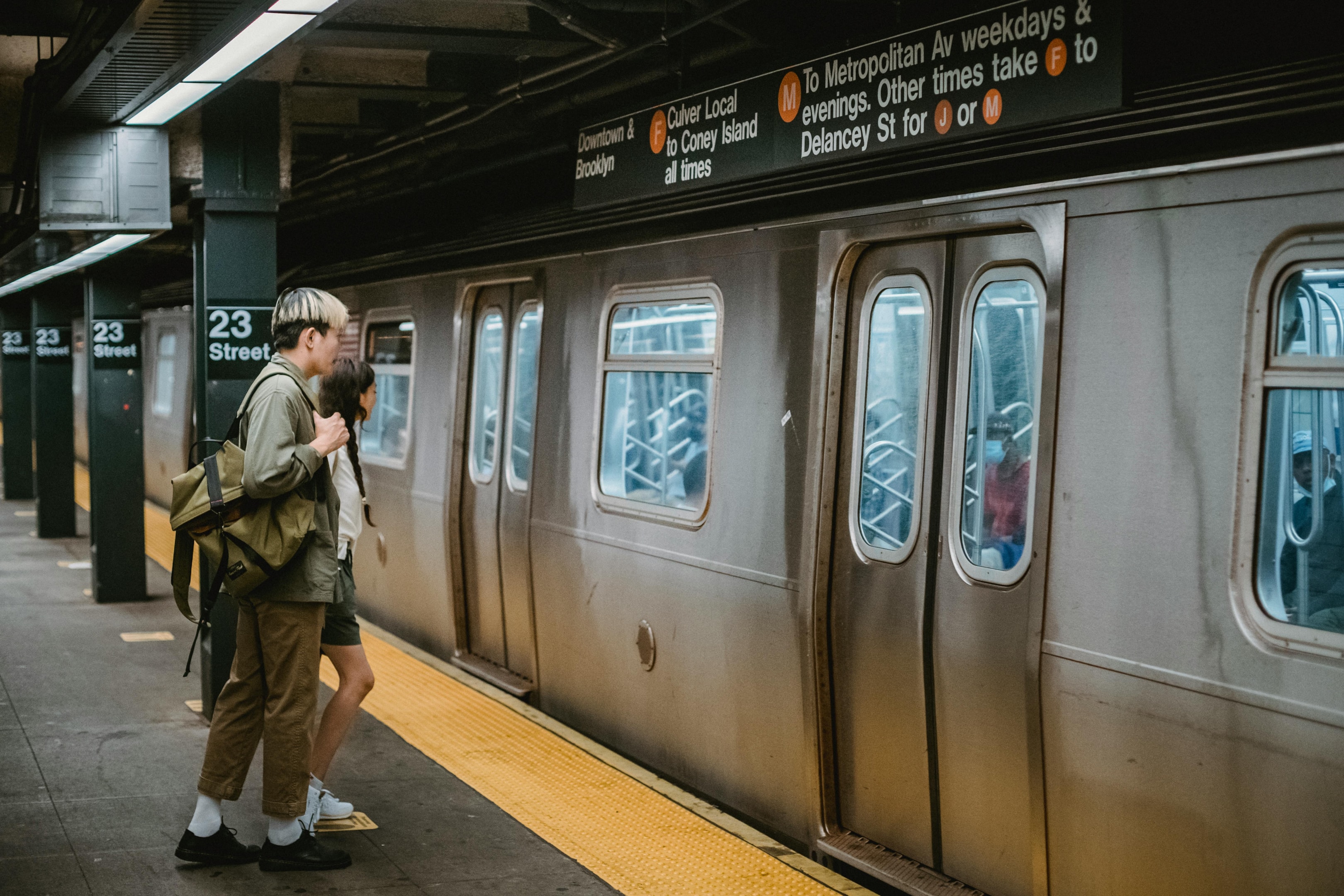 Photo by Samson Katt: https://www.pexels.com/photo/young-couple-standing-in-front-of-train-on-metro-station-platform-5225449/