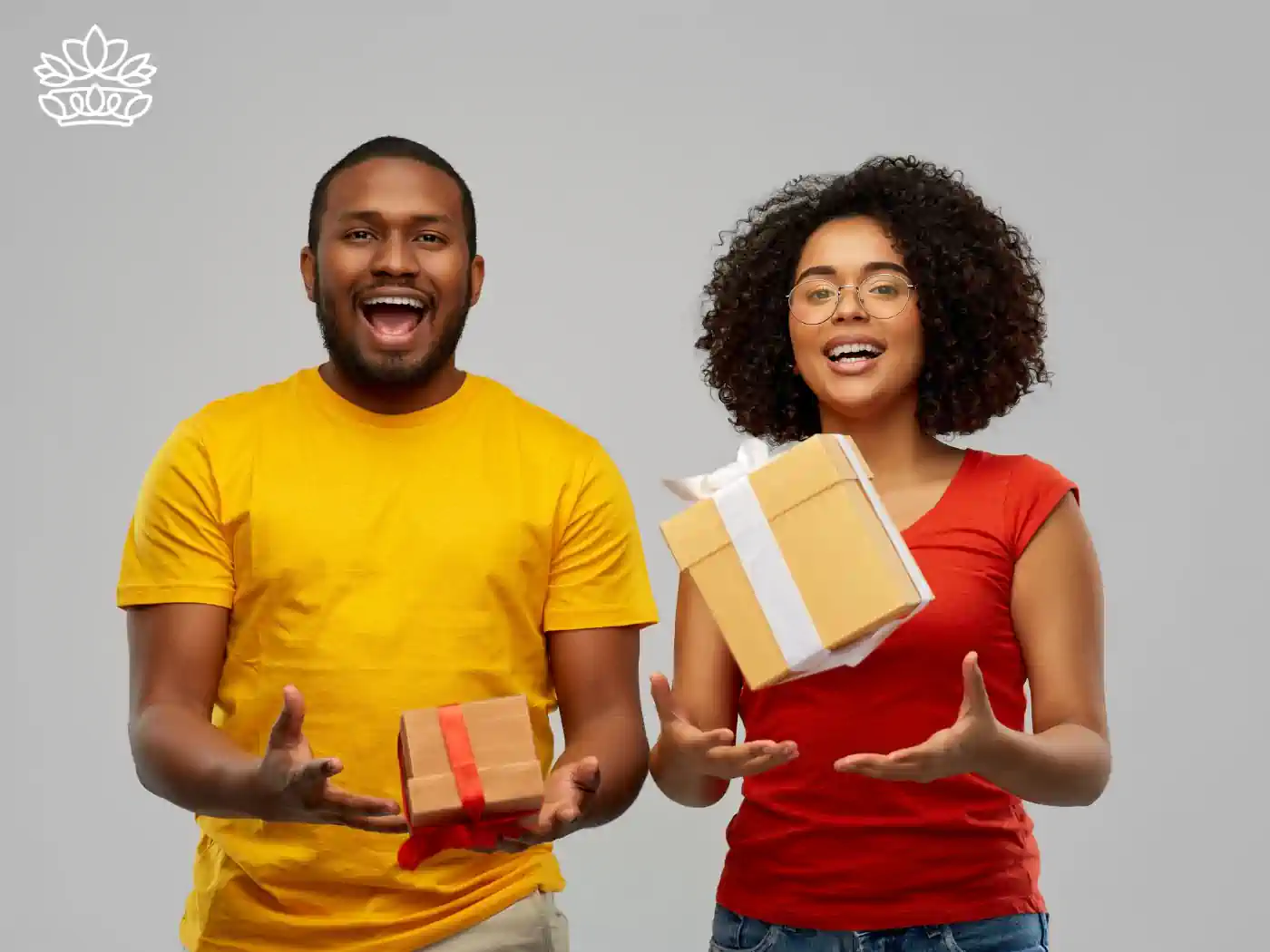 Two excited individuals holding luxury gift boxes - Fabulous Flowers and Gifts, Luxury Gift Boxes collection.