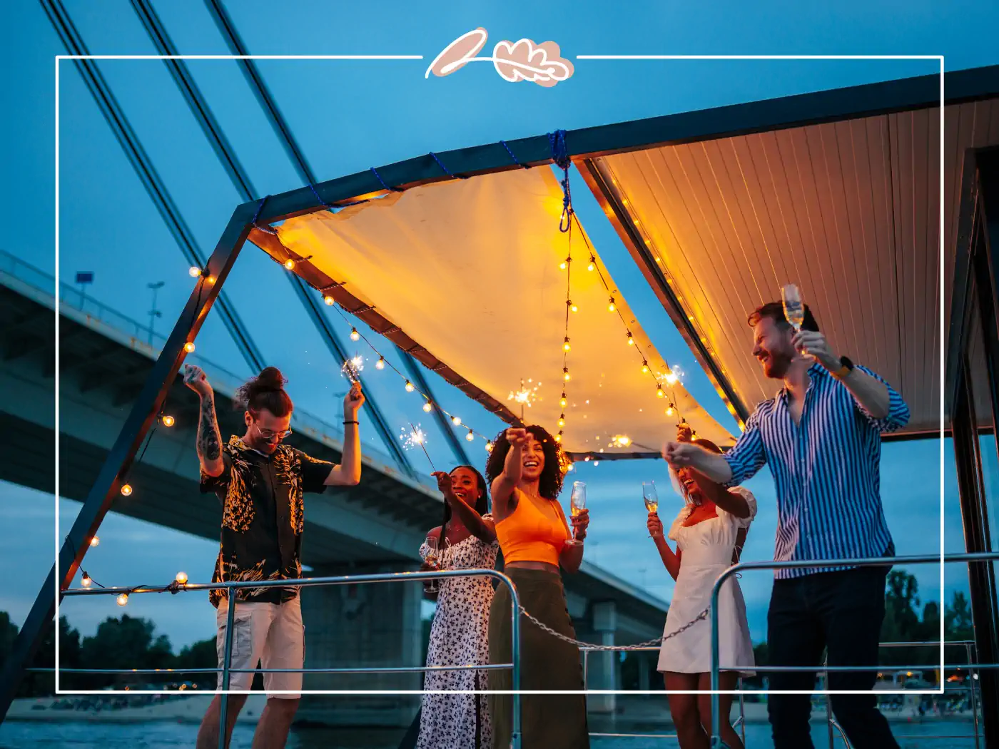 Group of friends celebrating under festive lights outdoors, fabulous flowers and gifts