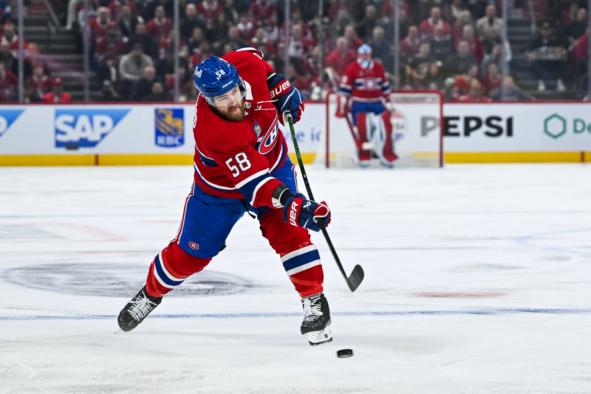 Apr 27, 2025; Montreal, Quebec, CAN; Montreal Canadiens defenseman David Savard (58) shoots the puck against the Washington Capitals during the first period in game four of the first round of the 2025 Stanley Cup Playoffs at Bell Centre.