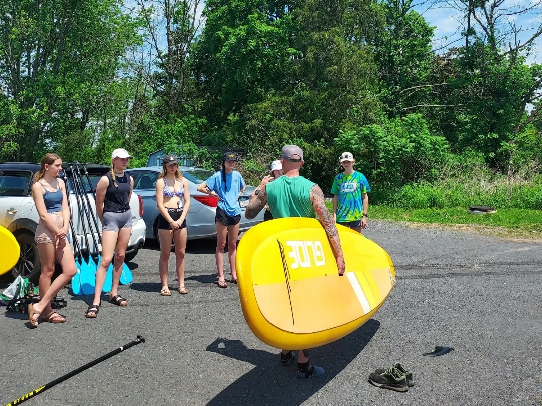 holding a paddle board