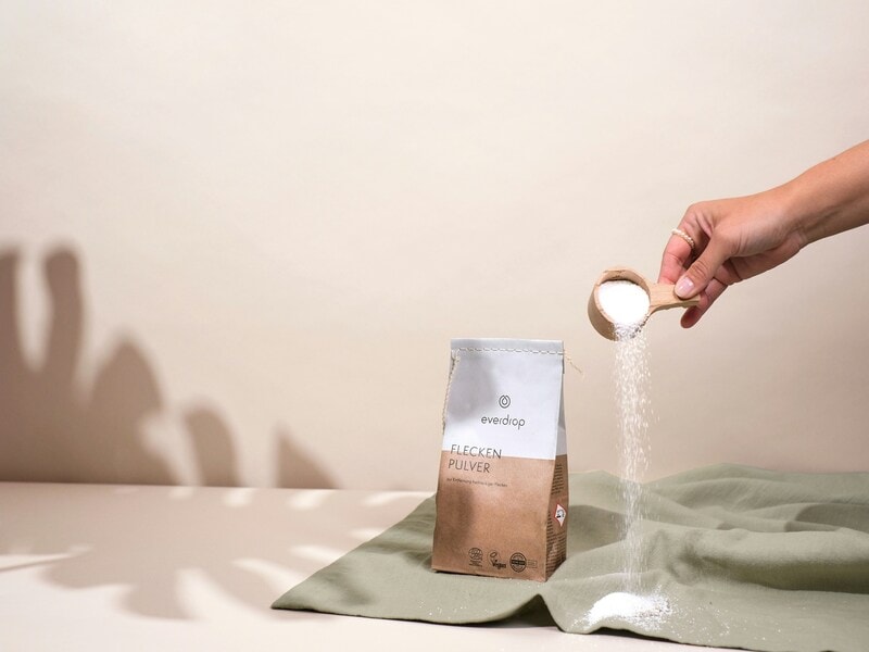 A person hand washing a cloth
