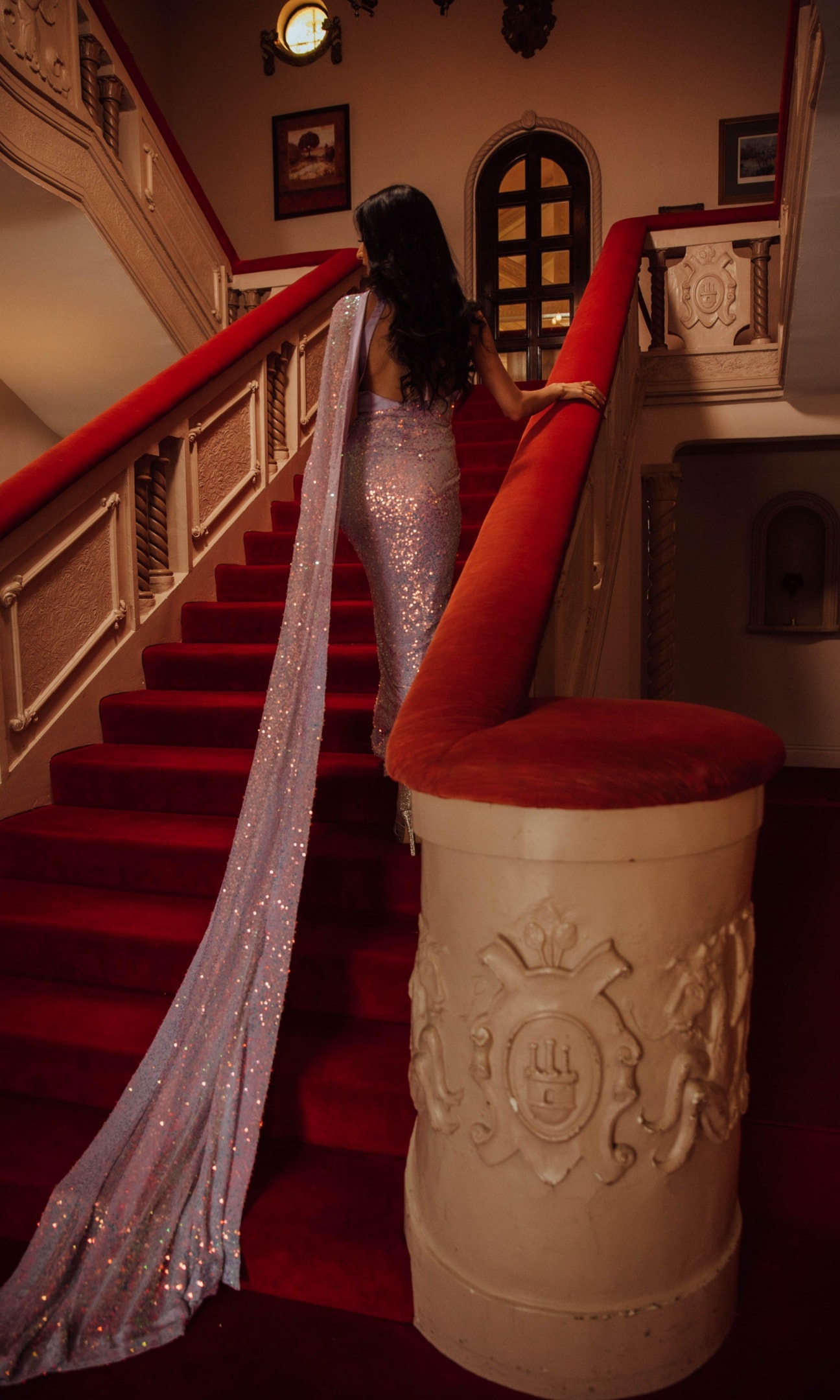 A beautiful woman is elegantly draped in a luxurious silk saree adorned with intricate gold patterns, showcasing the grace and beauty of this traditional Indian garment. The saree's stunning design highlights the quality and craftsmanship typical of pure silk sarees, making it perfect for formal occasions and celebrations.