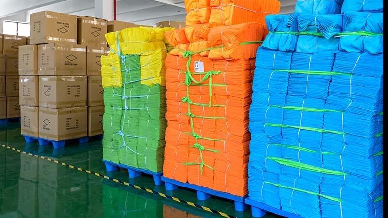 Color-coding bulk pack of microfiber towels at the Manywell factory